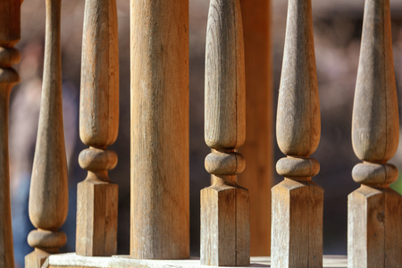 Wooden railing on the stairs as a background .