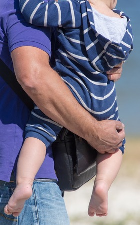 The boy in the hands of the pope .