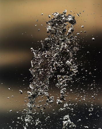 Water splashing in inversion as an abstract background .