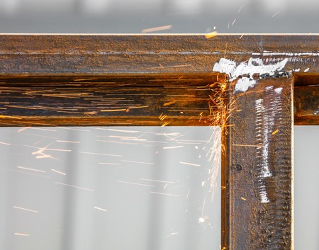 Sparks from cutting metal on the rack .
