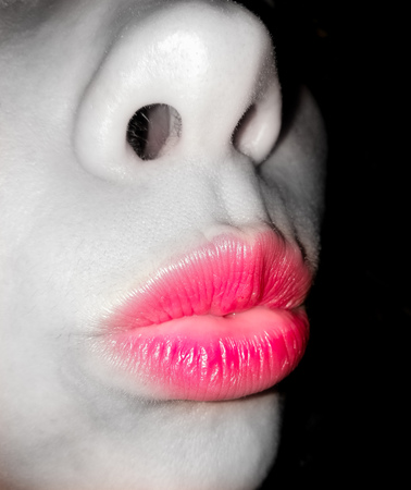 Red lips in black and white girl. Macro