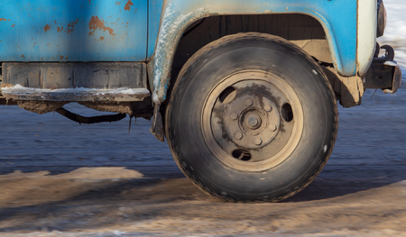 Car wheel in the snow in winter .