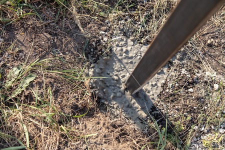 Concrete in the ground for the fence .の写真素材