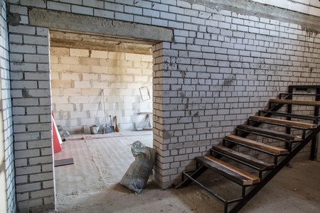 A room in a brick house under construction .の写真素材