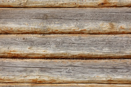 Wall with log house in the house as a background .の写真素材