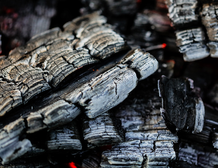 Burning coals of wood as a background.の写真素材