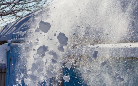 Snow flies through the air in winter .の写真素材