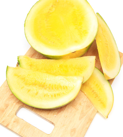 Sliced watermelon with yellow flesh on a white background .の写真素材