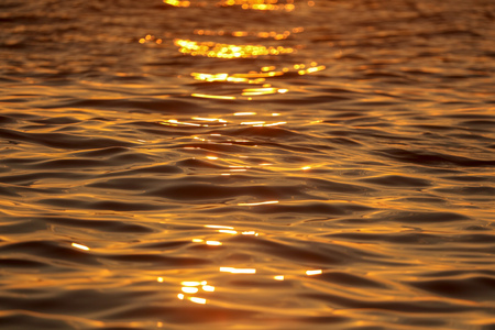 Smooth water in the sea in the rays of sunset .の写真素材