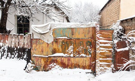 Snow on the fence in winter as a background .の写真素材