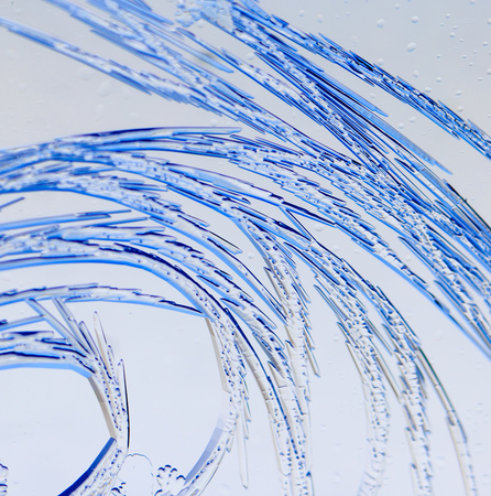 Snow patterns on glass as an abstract background .