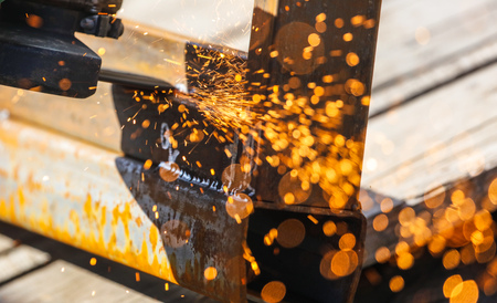 Sparks from cutting metal on the rack .