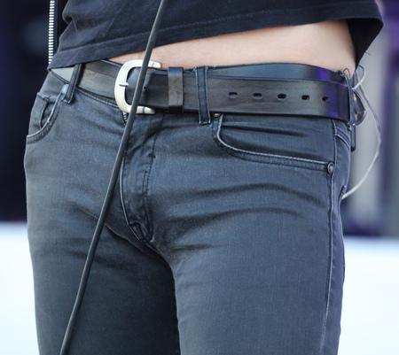 Black jeans with a belt on a man .の写真素材