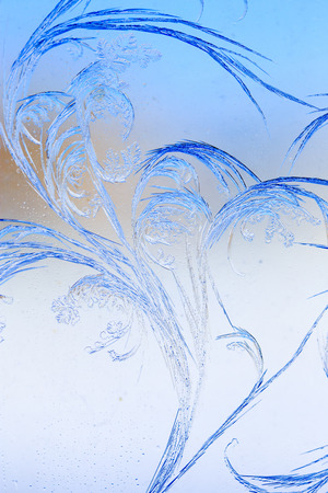 Snow patterns on glass as an abstract background .の写真素材