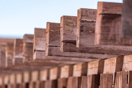Wooden bars on the roof of the house as a background .