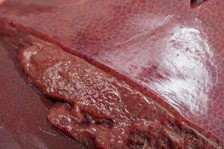 Pork liver pork as an abstract background. Texture