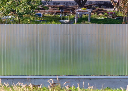 Metal fence on the summer cottage as a background .の写真素材