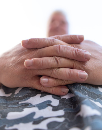 Hands on the belly of a man. Macroの写真素材