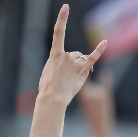 Two fingers on the hand at the concert .の写真素材