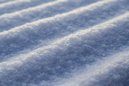Snow on the roof of the house as a background .の写真素材