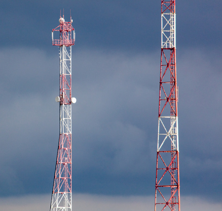 Metal tower for the transfer of tv on the background of clouds .の写真素材