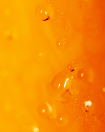 Drops of juice on pumpkin pulp as abstract background .の写真素材