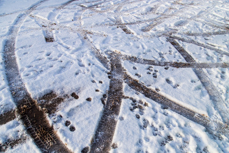 Traces of cars in the snow as a background .の写真素材