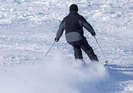 Man skiing in the snow in winter .の写真素材