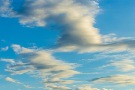Clouds after rain before sunset as a background .