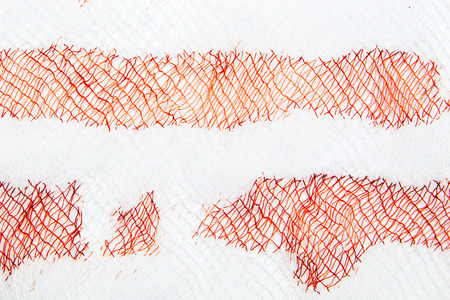 White napkin in red blood as abstract background .