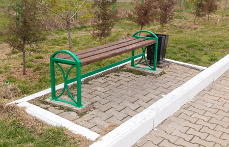 Wooden bench stands in the park .の写真素材