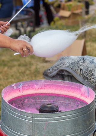 Cooking cotton candy on a city street .の写真素材