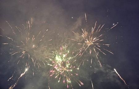 Fireworks in the sky at night in christmas .