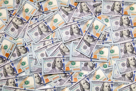 One hundred dollar bills on the table as background .の写真素材