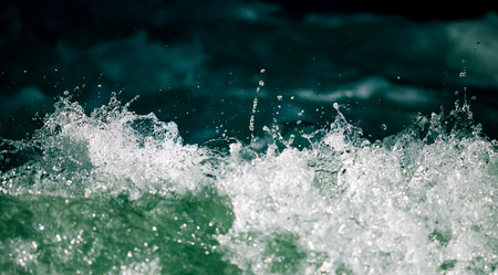 Splashes of water from the waves in the sea .の写真素材