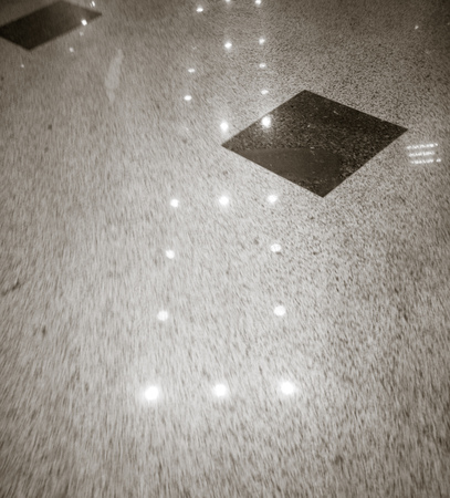 Reflection of light on a tiled floor as a background.