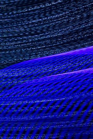 Blue lights in motion at night as an abstract background.
