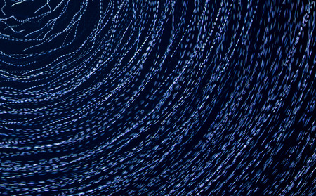 Blue lights in motion at night as an abstract background.