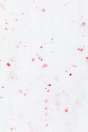 Red blood on white snow as a background.の写真素材