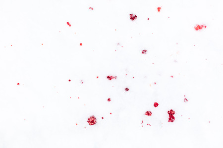 Red blood on white snow as a background.の写真素材