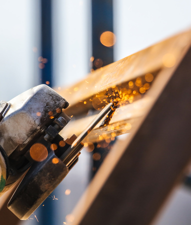 Sparks from cutting metal on the rack .