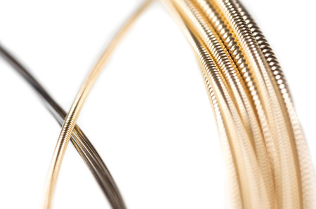 Strings for guitar isolated on a white background. Macro