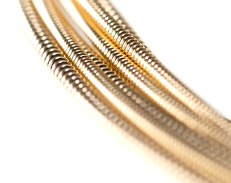 Strings for guitar isolated on a white background. Macro