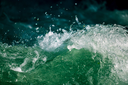 Splashes of water from the waves in the sea .