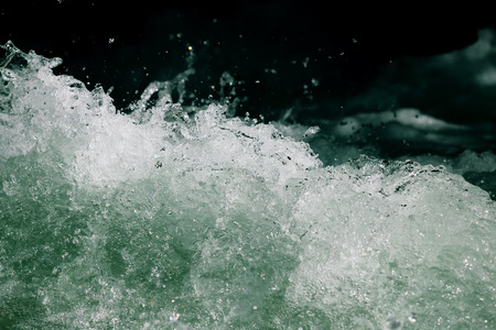 Splashes of water from the waves in the sea .の写真素材