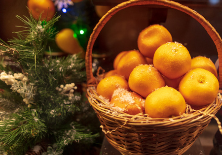 Basket with tangerines on a shop window .の写真素材