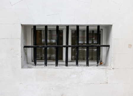 Grate on the wall as background .