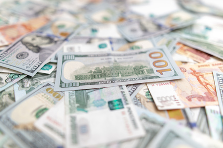 Dollars and Russian rubles on the table as background .
