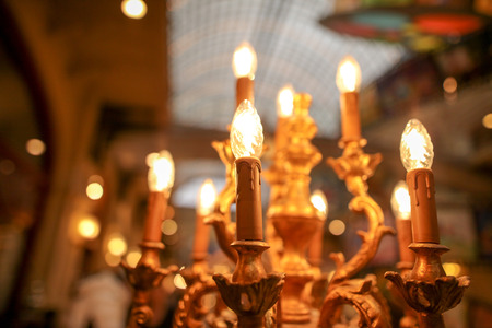 Lightbulbs on an antique candlestick .の写真素材