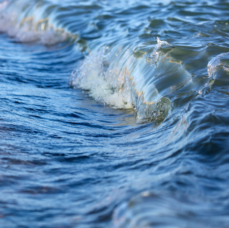 Waves on the seashore as an abstract background .